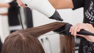 Blow-drying is a temporary solution to frizz-free hair, which can lead to heat damage. Courtesy The White Room