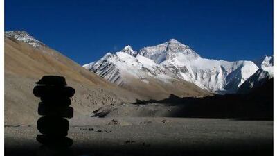 A cairn sits against the backdrop of the north face of Mt Everest. Photographs by Scott Macmillan for The National