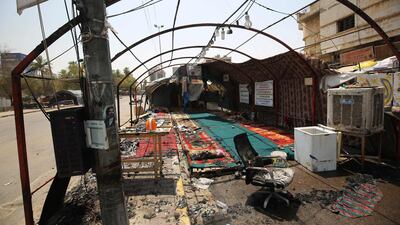 The remains of a protest tent that was burnt the previous night in Baghdad's Tahrir Square. Two demonstrators died in Baghdad overnight after being shot in confrontations with security forces. AFP