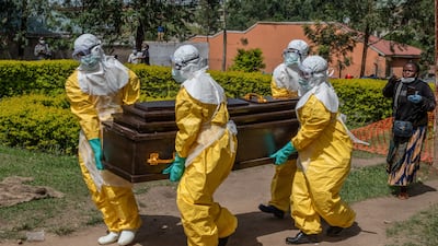 Red Cross workers carry the remains of Dr Tibenderana Katho Blaise who died of Ebola virus in Ituri province, Democratic Republic of Congo. Reuters