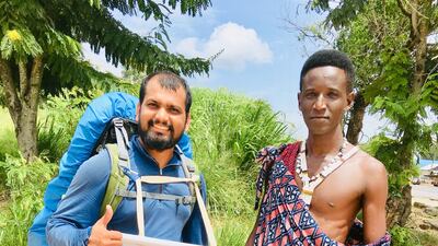 He was pictured here with a Masai tribesman in Tanzania