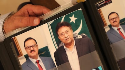 Shaukat shows an old photo of him with Pervez Musharraf, former president of Pakistan.