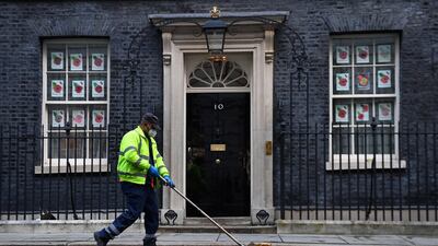 A man cleans up Whitehall. EPA