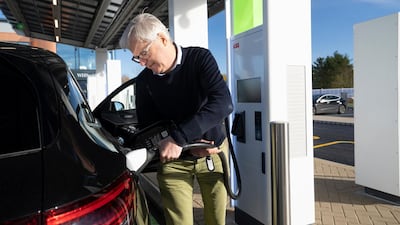 A customer charges his car at the new service station. Courtesy Gridserve