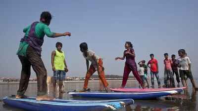 Rashed Alam has been teaching the girls to surf for three months teaches beach vendors to surf for the annual Cox’s Bazar surf competition.