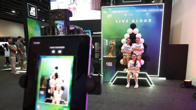 Fans can pose next to the Larry O'Brien NBA Championship Trophy