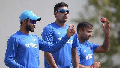India's Ravindra Jadeja (L), Ravichandran Ashwin (C) and Amit Mishra wait their turn to bowl in the nets during a training session ahead of the third Test cricket match between India and South Africa at The Vidarbha Cricket Association Stadium in Nagpur on November 24, 2015. AFP PHOTO / Indranil MUKHERJEE---- IMAGE RESTRICTED TO EDITORIAL USE - STRICTLY NO COMMERCIAL USE ----