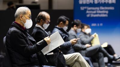Attendees socially distance during the Samsung Electronics Co. annual general meeting at the Suwon Convention Centre in Suwon, South Korea. Bloomberg