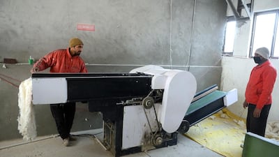 Kashmiri artisans work at a silk factory on the outskirts of Srinagar. AFP