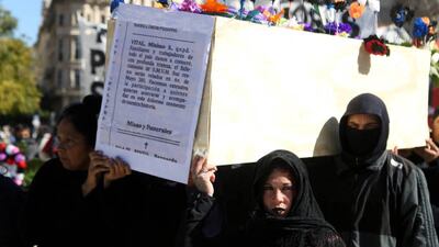 People hold a satirical "salary funeral procession", in reference to the loss of purchasing power to high inflation, in Buenos Aires, Argentina. Getty