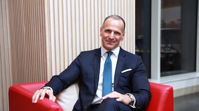 John Iossifidis of Noor Bank says he does not work for money; instead making a difference is more important to him. Victor Besa / The National