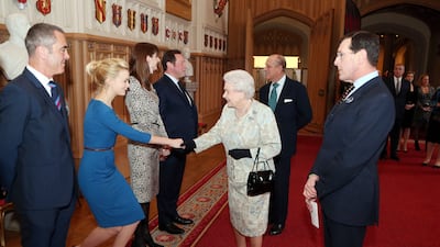 Queen Elizabeth with actress Carey Mulligan and actor James Nesbitt. Getty