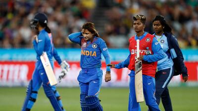 India's Taniya Bhatia retires hurt after being on the head by the ball while batting. Getty
