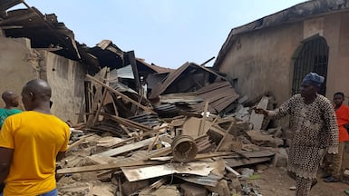 Residents inspect the damage after US troops launched a strike against Islamic State militants on Thursday, in Offa, Kwara State, Nigeria. Reuters