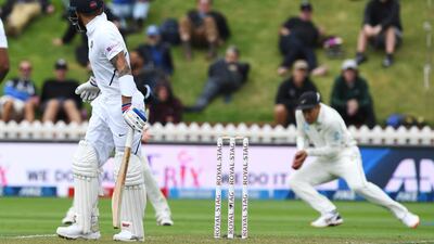 India's Virat Kohli, left, looks back as he is caught by New Zealand's Ross Taylor off the bowling of Kyle Jamieson at the Basin Reserve. AP