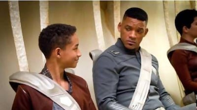 Jaden Smith and Will Smith star as a father and son who crash land on Earth years after it was evacuated. Courtesy Columbia Pictures