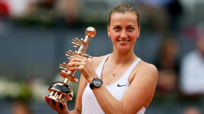 Czech Republic's Petra Kvitova poses with her trophy after beating Russia's Svetlana Kuznetsova in the Madrid Open final. Juanjo Martin / EPA