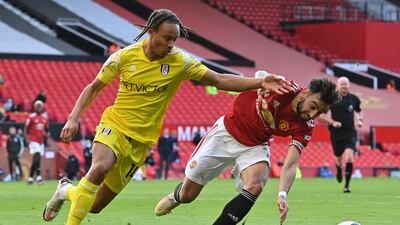 United midfielder Bruno Fernandes is challenged by Bobby De Cordova-Reid of Fulham. Getty