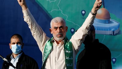 Hamas's chief, Yahya Sinwar, gestures during an anti-Israel rally in Gaza city. His apparent death on Thursday could either lead to peace, the execution of hostages or more war. Reuters