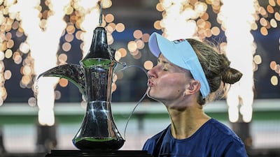 Barbora Krejcikova of Czech Republic lifts the Dubai Duty Free Tennis Championships trophy after beating Iga Swiatek of Poland in the final on Saturday, February 25, 2023. EPA