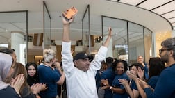 Dubai resident Mohammad Shaka becomes the first to purchase one of the new iPhone models. Antonie Robertson / The National