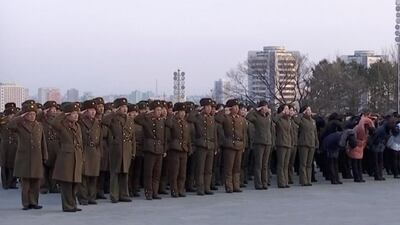 North Korean military personnel salute as they lay flowers in front of giant statues of Kim Il Sung and Kim Jong Il on Mansu Hill in central Pyongyang, Thursday, Feb. 8, 2018. North Korea held a military parade and rally on Kim Il Sung Square on Thursday, just one day before South Korea holds the opening ceremony for the Pyeongchang Winter Olympics. KRT / AP