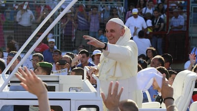 Pope Francis, centre, bids farewell to the faithful after celebrating a mass at Amman International Stadium, Jordan on May 24, 2014. The pontiff held a mass service lasting about three hours at the stadium attended by about 20,000 people, waving Jordanian and Vatican flags. Nader Daoud/EPA