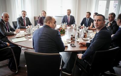 Wladimir Klitschko attends a meeting with German Finance Minister Christian Lindner, back, second left, in Berlin. AP