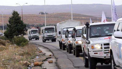 An aid convoy carrying food, medicine and blankets heads to the besieged Syrian town of Madaya on January 11, 2016, at the same time as convoys carry aid for another two Syrian towns under siege, Fuaa and Kafraya. Louai Beshara / AFP