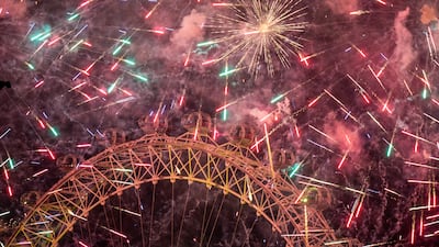 Fireworks light up the sky over the London Eye and Big Ben during New Year celebrations, on January 1, 2023. PA