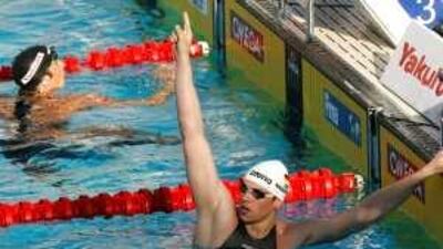 Paul Biedermann is No 1 after beating Michael Phelps, back, in the 200m freestyle.