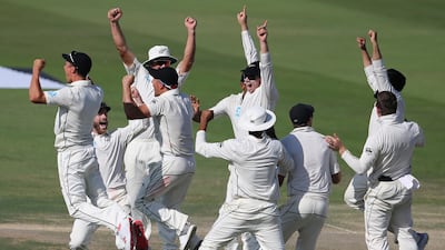New Zealand players after defeating Pakistan in the first Test match in Abu Dhabi. AP Photo
