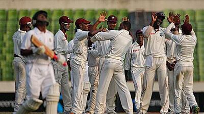 West Indies players celebrate the wicket of Banglades batsman Raqibul Hasan on their way to winning the second Test by 229 runs to secure their first away series win in eight years.