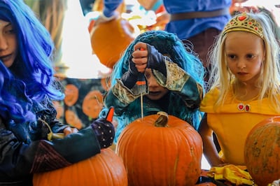 Pumpkin carving and decorating is a great way to have Halloween fun at home. AP