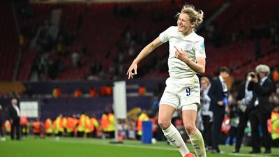 England striker Ellen White celebrates on the pitch after the Euro 2022 Group A win against Austria. AFP