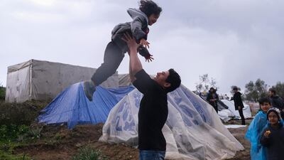 Migrants play next to their makeshift tents outside the perimeter of the overcrowded Moria refugee camp on the northeastern Aegean island of Lesbos, Greece, Wednesday, March 11, 2020. AP Photo
