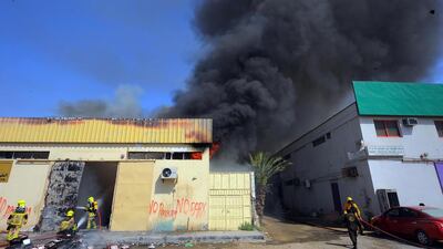 A shoe factory and a wood warehouse in Sharjah's 3rd Industrial Zone caught fire on May 7, 2014. It was the second fire in the area this week. Courtesy Al Ittihad