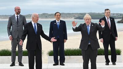 President of the European Council Charles Michel, US President Joe Biden, Japanese Prime Minister Yoshihide Suga, Mr Johnson and Italian PM Mario Draghi pose for the leaders' official photo during the G7 summit in Cornwall, in June 2021. Getty Images