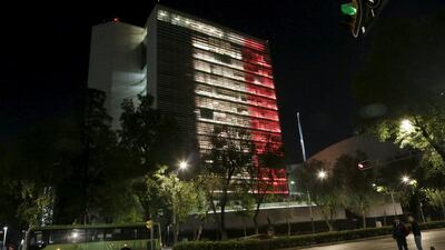 The back, yellow and red colours of the Belgian national flag are seen projected on the Senate building in tribute to the victims of the Brussels attacks, in Mexico City, Mexico. Henry Romero / Reuters