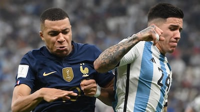 France forward Kylian Mbappe and Argentina's Enzo Fernandez fight for the ball during the World Cup final. AFP