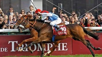 Olivier Peslier riding Solemia, front, surges past Orfevre and Christophe Soumillon to win the Prix de l’Arc de Triomphe at Longchamp in France on Sunday.