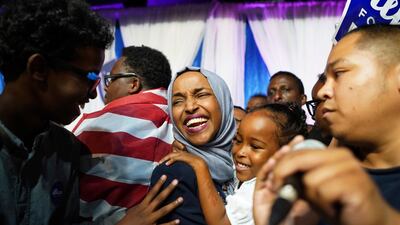 Ilhan Omar, centre, celebrates with her children after winning the Democratic primary in Minnesota's Fifth Congressional District. Star Tribune via AP
