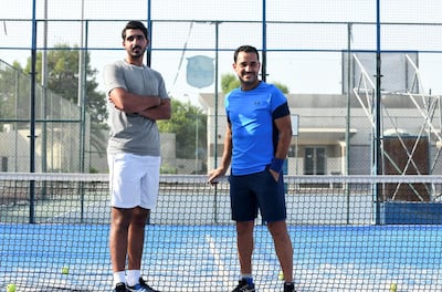 Naser Al Ketbi, 23, with his guardian and mentor Hand Esaad, 50 at the Abu Dhabi Country Club. Khushnum Bhandari / The National