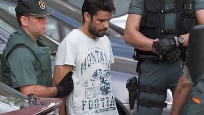 Mohamed Aallaa, one of the four men suspected of involvement in the terror cell that carried out twin attacks in Spain, on his way from a detention center in Tres Cantos, near Madrid, on August 22, 2017 to the National Court, which deals with terrorism cases. AFP