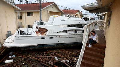 Brenda Brennan outside her apartment in Fort Myers, Florida, after Hurricane Ian passed through in September. AFP