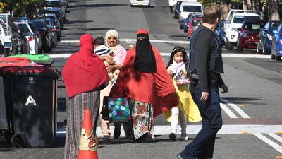 Police direct locals around the block of flats after counter-terrorism raids across the city at the weekend. William West.