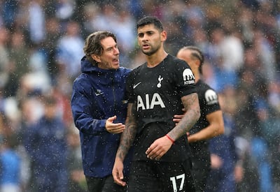 Spurs manager Thomas Frank with Cristian Romero at the Amex Stadium. Getty Images