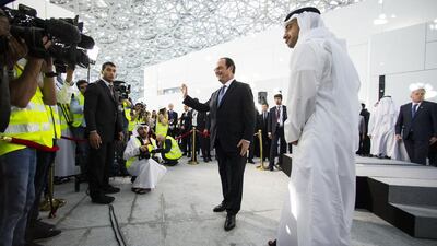 Sheikh Abdullah bin Zayed, Minister of Foreign Affairs and International Cooperation, gives French president Francois Hollande a tour of the Louvre Abu Dhabi site yesterday on Saadiyat Island. The museum is scheduled to open next year. Christopher Pike / The National