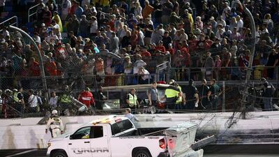 Damage to the catch fence is seen after Austin Dillon's crash at the Nascar Coke Zero 400 on Monday morning in Daytona Beach, Florida. Chris Graythen / Getty Images / AFP