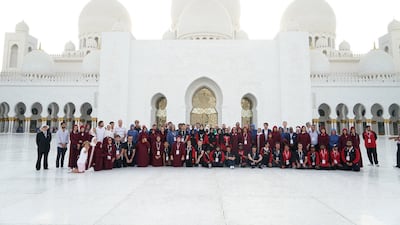 Members of the New Zealand and UAE Special Olympics teams stand together at Sheikh Zayed Grand Mosque. Wam
